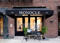 自行车,玻璃门,盆栽植物,红砖墙,商业标志牌,咖啡店